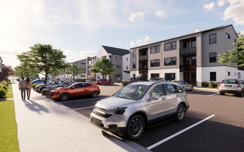 a parking lot with cars and buildings