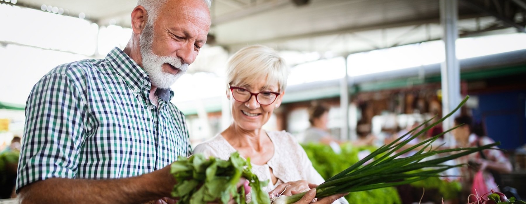 a man and a woman at a farmers market